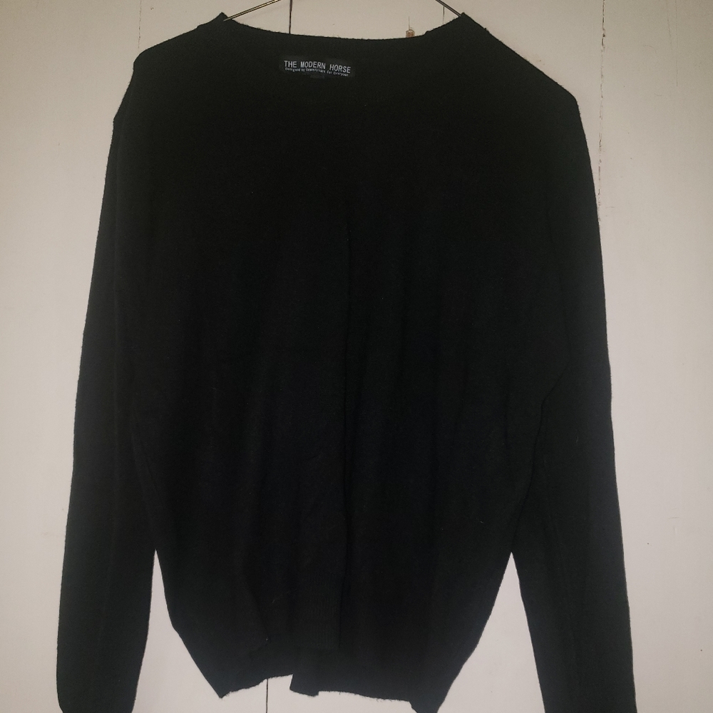 Size Medium cotton/polyester blend sweater.